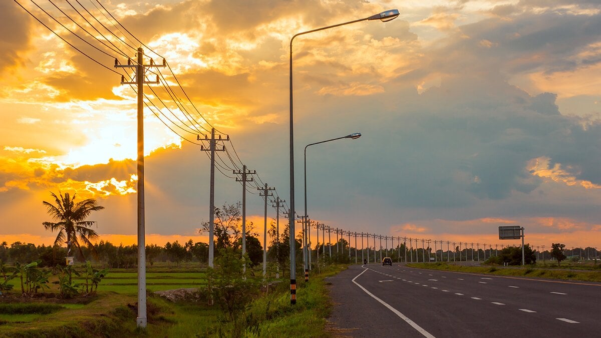 Overhead lines photographed in the sunset.